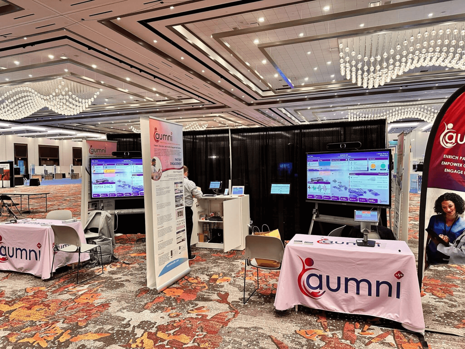 Aumni booth at HIMSS 2025